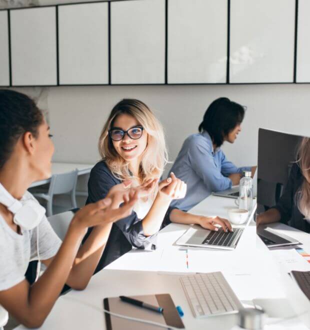 Team members collaborating around a table in an office